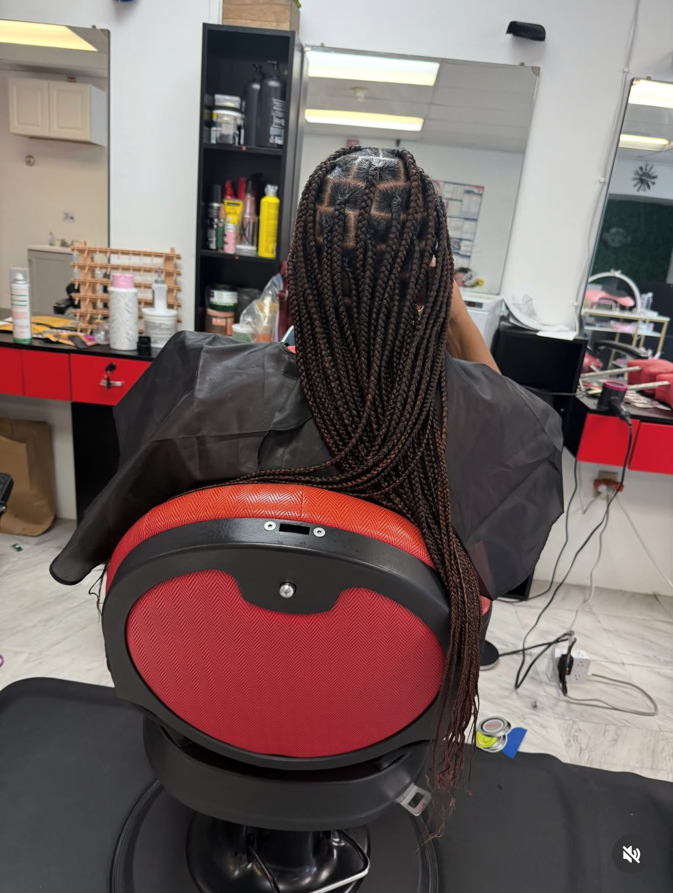 Long box braids in salon chair